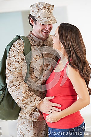 Pregnant Wife Greeting Military Mother Home On Leave