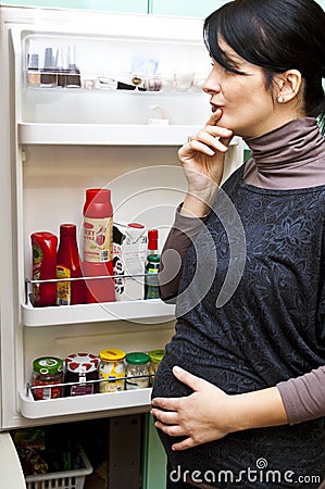 Pregnant woman and fridge