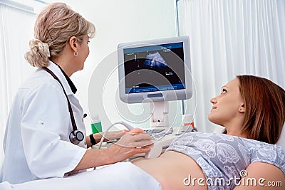 Pregnant woman getting ultrasound