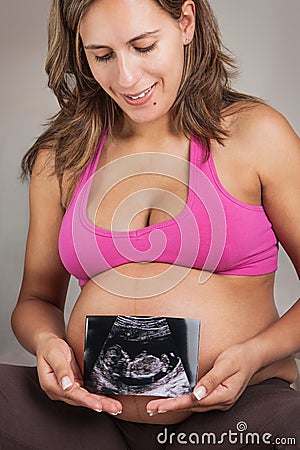 Pregnant Woman Holding Ultrasound