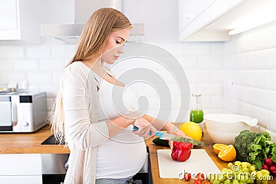 Pregnant woman at kitchen