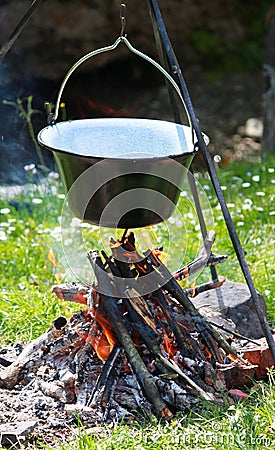 Preparing food on campfire