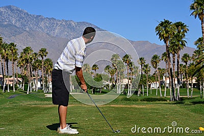 Preparing to hit a golf ball