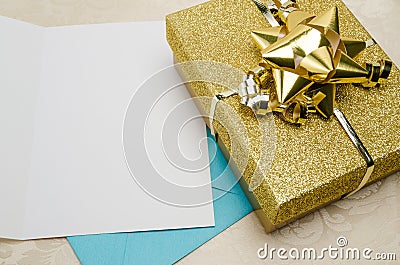 A Present Wrapped in Gold with a Card