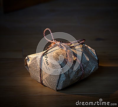 Present wrapped in newspaper