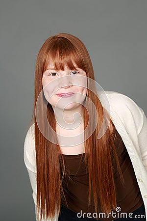 Preteen redhead girl with freckles and dimples