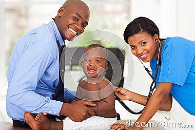 Nurse examining baby