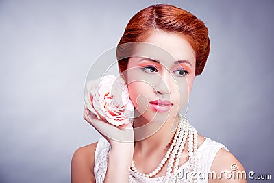 Pretty asian woman with flower and pearls