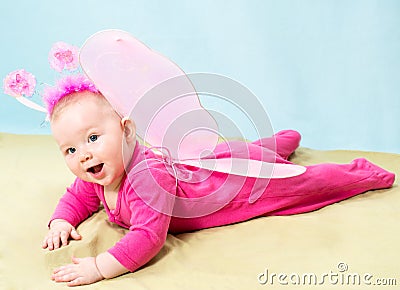 Pretty child girl, dressed in butterfly costume on background