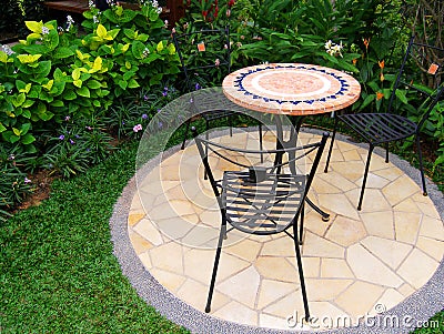 Pretty garden with paving and furnitures