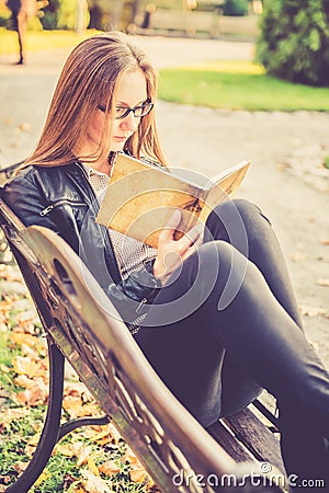 Pretty girl in fall reading
