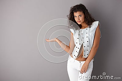 Pretty girl posing over gray background