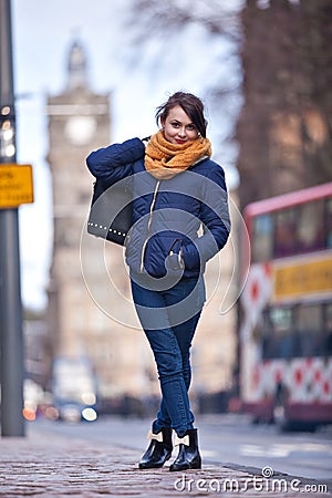 Pretty girl walking on the road