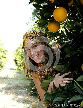 Pretty islam woman in orange grove smiling
