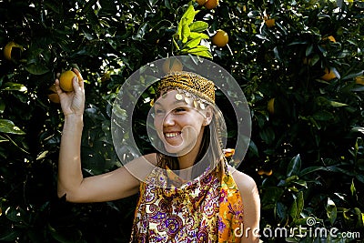 Pretty islam woman in orange grove smiling