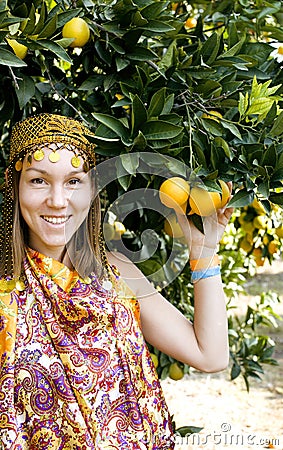 Pretty islam woman in orange grove smiling