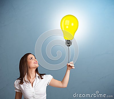 Pretty lady holding a light bulb balloon