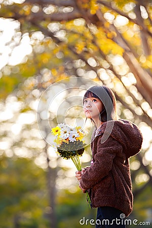 http://thumbs.dreamstime.com/x/pretty-little-asian-girl-holding-bunch-flowers-nature-background-36208989.jpg