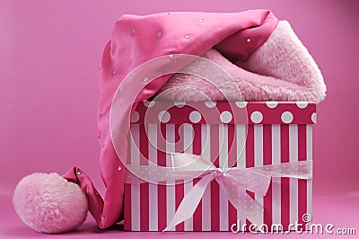 Pretty pink feminine santa hat and polka dot and stripe gift box