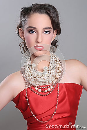 Pretty Red Themed Fashion Model Wearing Lots of Pearls