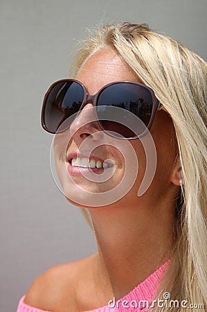 Pretty sun-tanned blond girl in natural light
