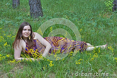 Pretty woman with bouquet of wild flowers
