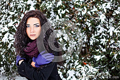 Pretty woman cold in winter forest