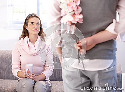 Pretty woman getting flowers from man