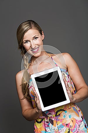 Pretty woman holding a blank tablet-pc
