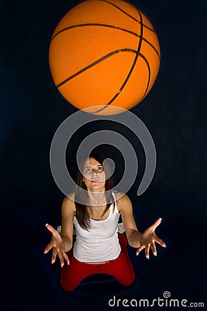 Pretty woman playing basketball
