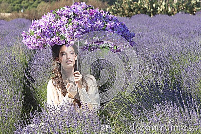 Pretty Young Girl Outdoors in a Lavender Flower Field