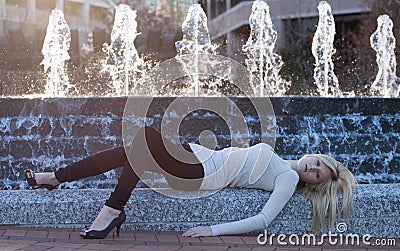 Pretty Young WOman in Front of Fountain