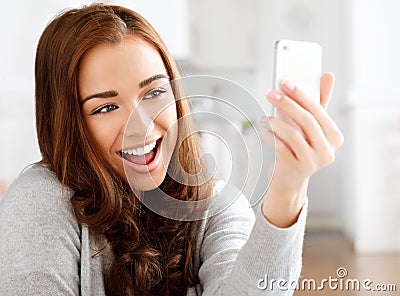 Pretty young woman using mobile phone