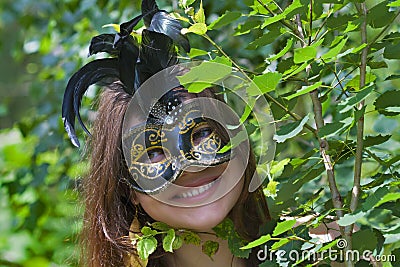Pretty young woman with venetian carnival mask