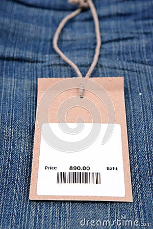 Price tag with barcode on jeans