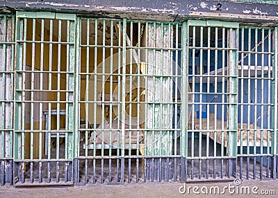 Prison bars and beds within the cells