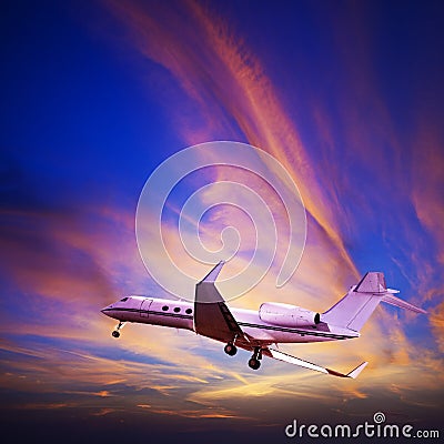 Private jet in a spectacular sunset sky