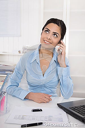 Private talk during working hours. Young indian businesswoman i