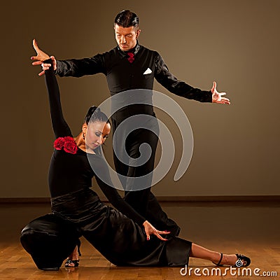 Professional ballroom dance couple preform an exhibition dance