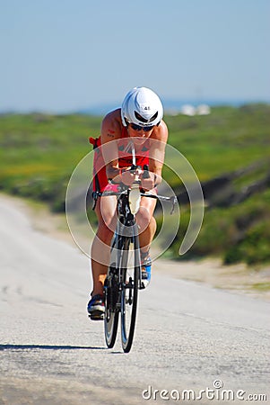 Professional female Ironman triathlete cycling