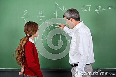 Professor Teaching Mathematics To Female Student