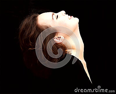 Profile of beautiful woman, isolated on black