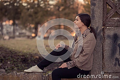 Profile of natural beauty romantic woman sitting in the nature