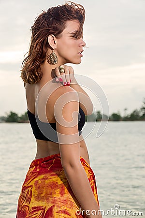 Profile of woman in the beach