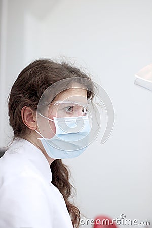 Profile of young doctor in mask