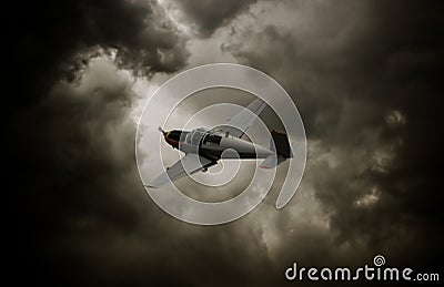 Propeller airplane with dark clouds