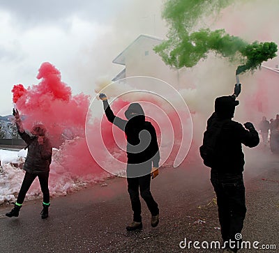 Protest with protesters wearing black gloves