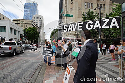 Protesters with save Gaza sign