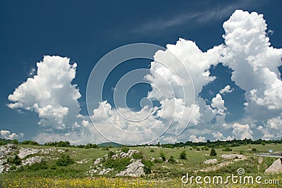 Puffy clouds in countryside