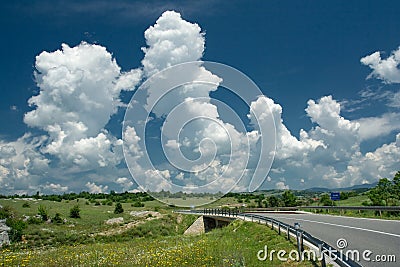 Puffy clouds in countryside